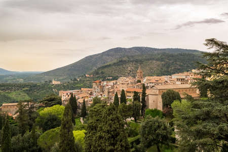 Italian village of Tivoli on the hill with cloudy skyの写真素材