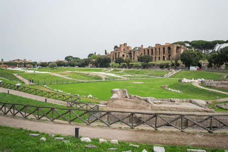 Rome maximum circus with cloudy sky and green grassのeditorial素材