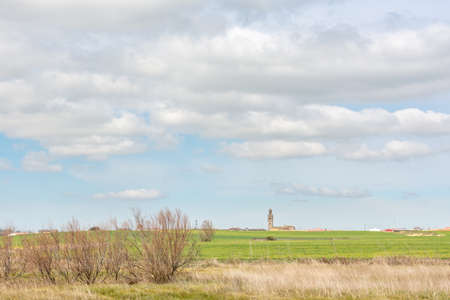 Castilian landscape with cereal fields and town, Fuentes de Nava, Tierra de Campos, Palencia, Castilla y Leon, Spainの写真素材
