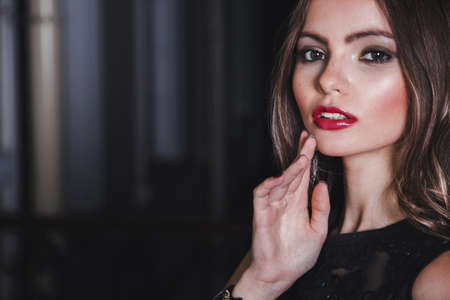 Beautiful girl in evening dress with long hairの写真素材