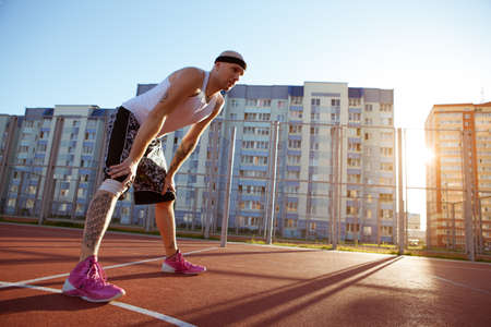 The man during a basketball stands in readiness posture for the game.の写真素材