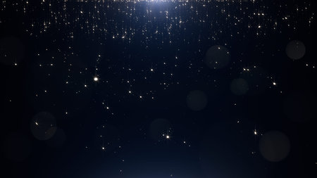 Glamorous golden particles on a black background
