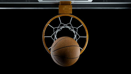 3d render Basketball hit the basket on a black backgroundの写真素材