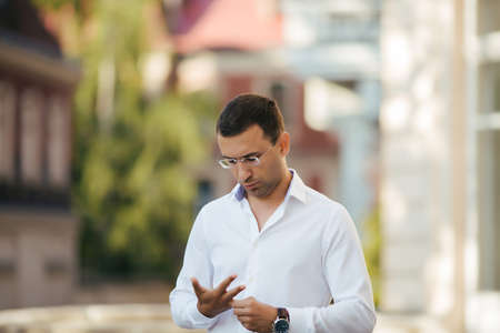 Portrait of young man with crossed armsの写真素材