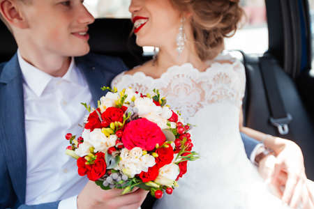 brides in a car driving through the city.の写真素材