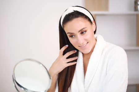 Beautiful girl with natural make-up at home Beauty and skin care conceptの写真素材