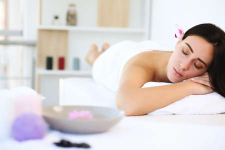 Beautiful young woman in a spa, brunetteの写真素材