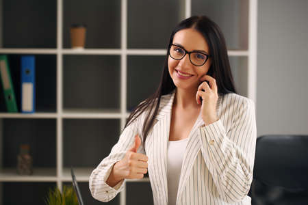 office worker analyzes the data, compiles an accounting report, creates positions in coworkingの写真素材