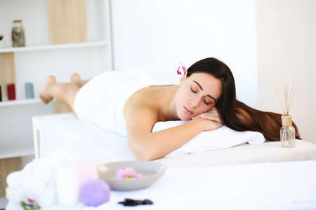 Massage and body care. Spa body massage. Woman having massage in spa.の写真素材