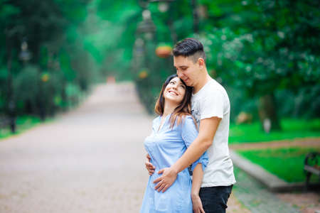 Couple in a forest, warm summer, lovely weatherの写真素材