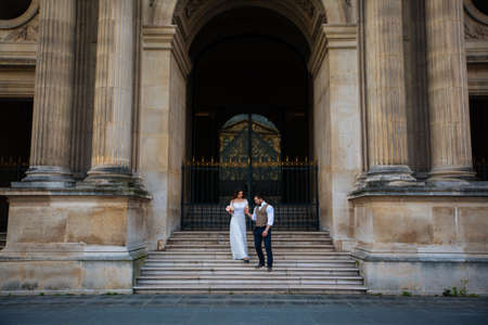wedding couple. The bride in a beautiful wedding dress, the bride in a stylish tuxedo, Paris Franceの写真素材
