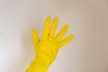 yellow gloves on a white backgroundの写真素材