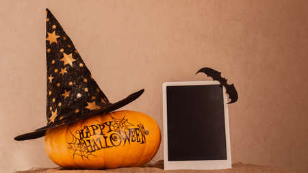 orange pumpkin with the inscription happy Halloween with a layout for your text, a celebration concept and an invitation to Halloweenの写真素材