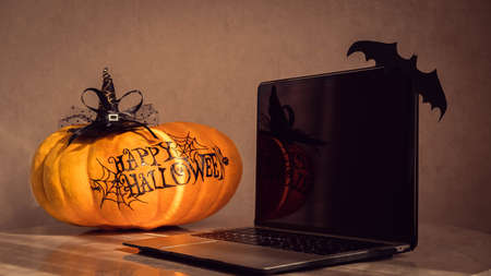 orange pumpkin with the inscription happy Halloween with a layout for your text, a celebration concept and an invitation to Halloweenの写真素材