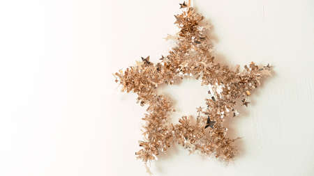 a mock-up of a Christmas star with a place for golden tinsel textの写真素材