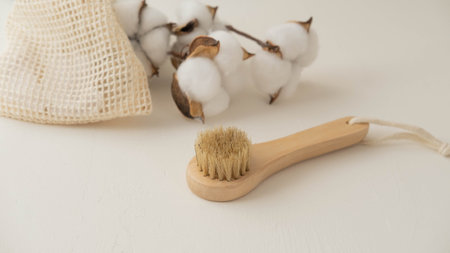 a small wooden eco-brush for facial massage with natural bristles