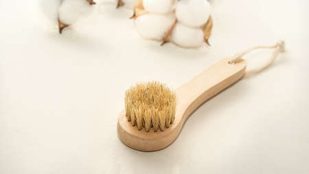 a small wooden eco-brush for facial massage with natural bristlesの写真素材