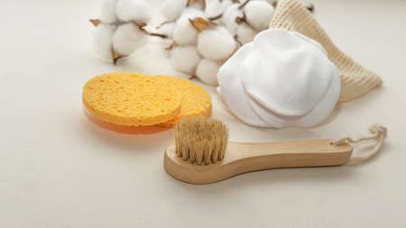 a small wooden eco-brush for facial massage with natural bristlesの写真素材
