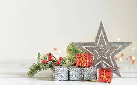 small christmas silver gifts on a white background with lightsの写真素材