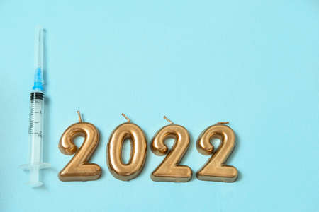 figures 2022 on a blue background , the concept of Christmas and medicineの写真素材