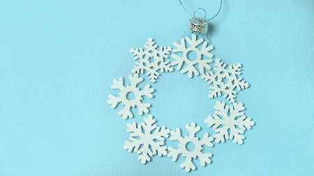 the layout of a Christmas tree toy on a blue background , the concept of Christmas and medicineの写真素材