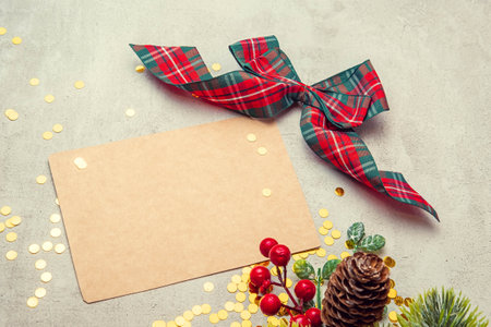 crab sheet for writing with a red bow on a concrete background with sequinsの写真素材