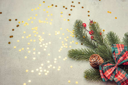 christmas concrete background with fir twigs and sequins , the concept of Christmas and Christmas salesの写真素材