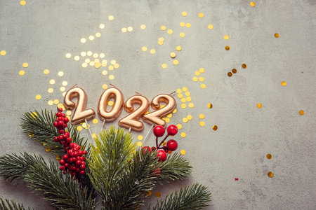 christmas concrete background with fir twigs and sequins , the concept of Christmas and Christmas...