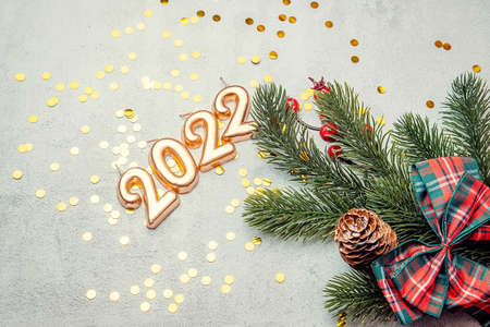 christmas concrete background with fir twigs and sequins , the concept of Christmas and Christmas salesの写真素材