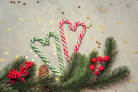 christmas concrete background with fir twigs and sequins , the concept of Christmas and Christmas salesの写真素材