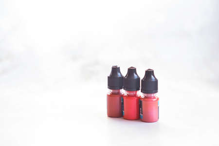 tubes with pigments for permanent lip makeup on a light backgroundの写真素材