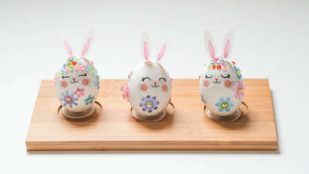 banner. Easter eggs in the form of hares on a white background. Flat styling. Copy the place for the text.の写真素材