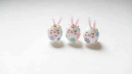 banner. Easter eggs in the form of hares on a white background. Flat styling. Copy the place for the...