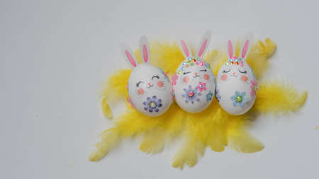 banner. Easter eggs in the form of hares on a white background. Flat styling. Copy the place for the text.の写真素材