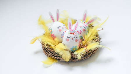banner. Easter eggs in the form of hares on a white background. Flat styling. Copy the place for the text.の写真素材