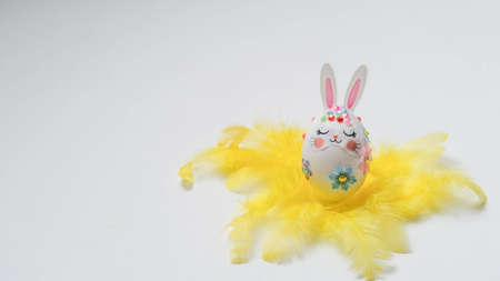 banner. Easter eggs in the form of hares on a white background. Flat styling. Copy the place for the text.の写真素材