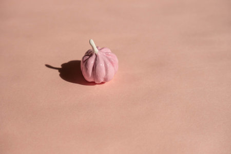 pale pink pumpkins on a light pink background , an abstract Halloween conceptの写真素材
