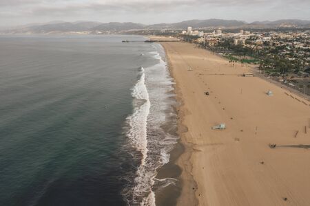 Beautiful Wide View over Manhattan Beach in California with Waves crashing onto Beachの写真素材