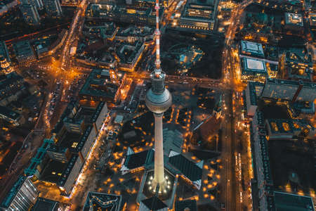 Berlin, Germany Alexanderplatz TV Tower after Sunset at Dusk with beautiful lit up Streets in orange lights of a Big City Cityscape, Aerial View circa September 2019のeditorial素材