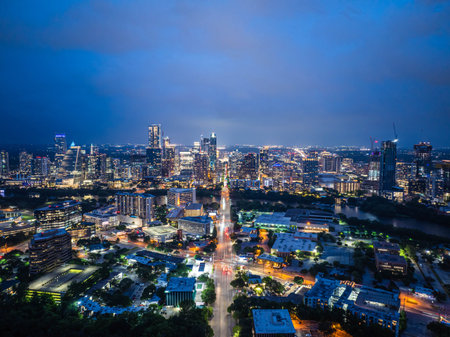Austin, Texas skyline shining brightly at twilight with city lights creating a captivating display across the cityscape, mirroring vibrant spirit of an american metropolis