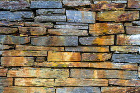 Old rustic stone wall - high quality texture / backgroundの写真素材
