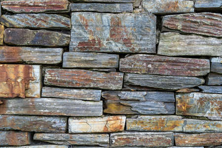 Old rustic stone wall - high quality texture / backgroundの写真素材
