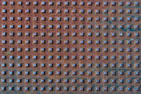 Square shapes on metal rusted surface with patterns and cracks - high quality texture / backgroundの写真素材
