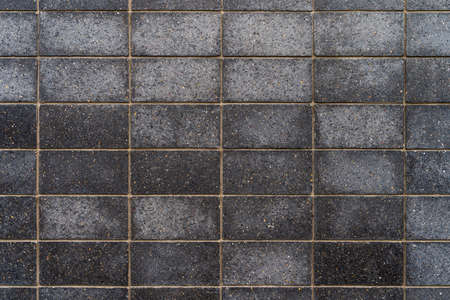 Dark grey granite tiles with fine patterns - high quality texture / backgroundの写真素材