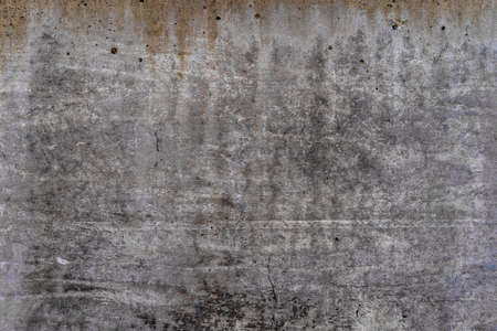 Aged concrete with orange stains patterns and cracks - high quality texture / backgroundの写真素材