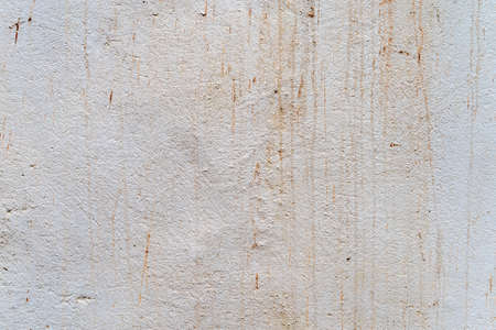 Aged concrete with orange patterns and cracks - high quality texture / backgroundの写真素材
