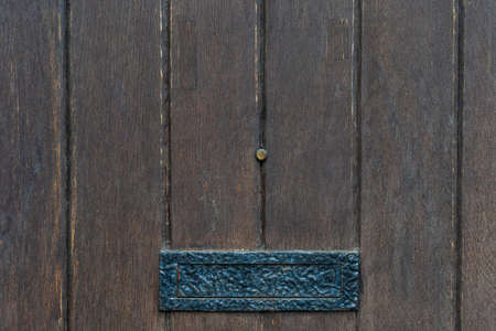 Vintage black door panels with ancient letterbox - high quality texture / backgroundの写真素材