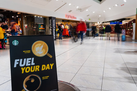 Dublin, Ireland â January 2019 Dublin airport terminal 1, people rushing for their flights, duty free shopping area, Starbucks coffee sign, motion blurのeditorial素材