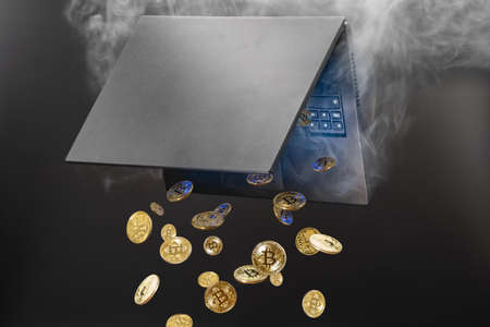 Concept of mining cryptocurrency, Bitcoins generated from steaming laptopの写真素材