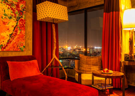 Bangkok, Thailand, March 2013 Luxurious penthouse, wall arts and designer interior, view on night cityscapeのeditorial素材